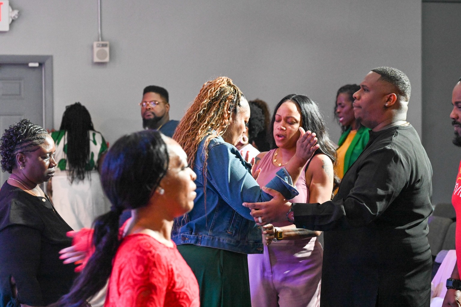 Myron and Alyssa ministering and praying with the Outpour community